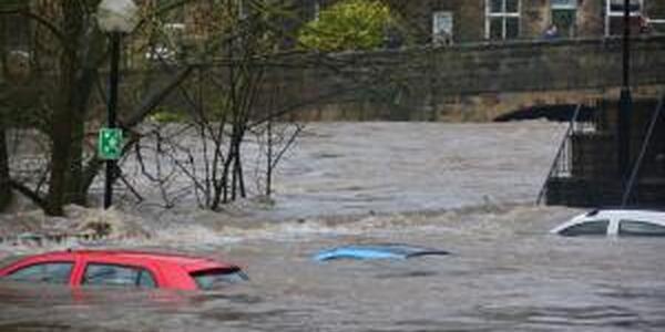 flooded river covers tops of cars