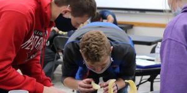 youth building towers with potato chips