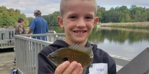 boy holding fish