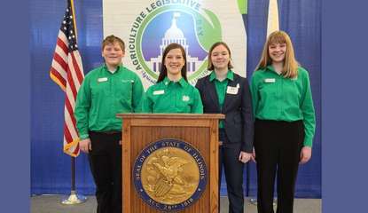 youth reps pose by a podium at the event