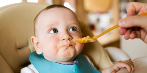 feeding food to baby